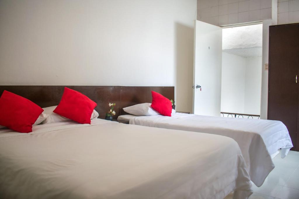 Postel nebo postele na pokoji v ubytování Hotel Cupules