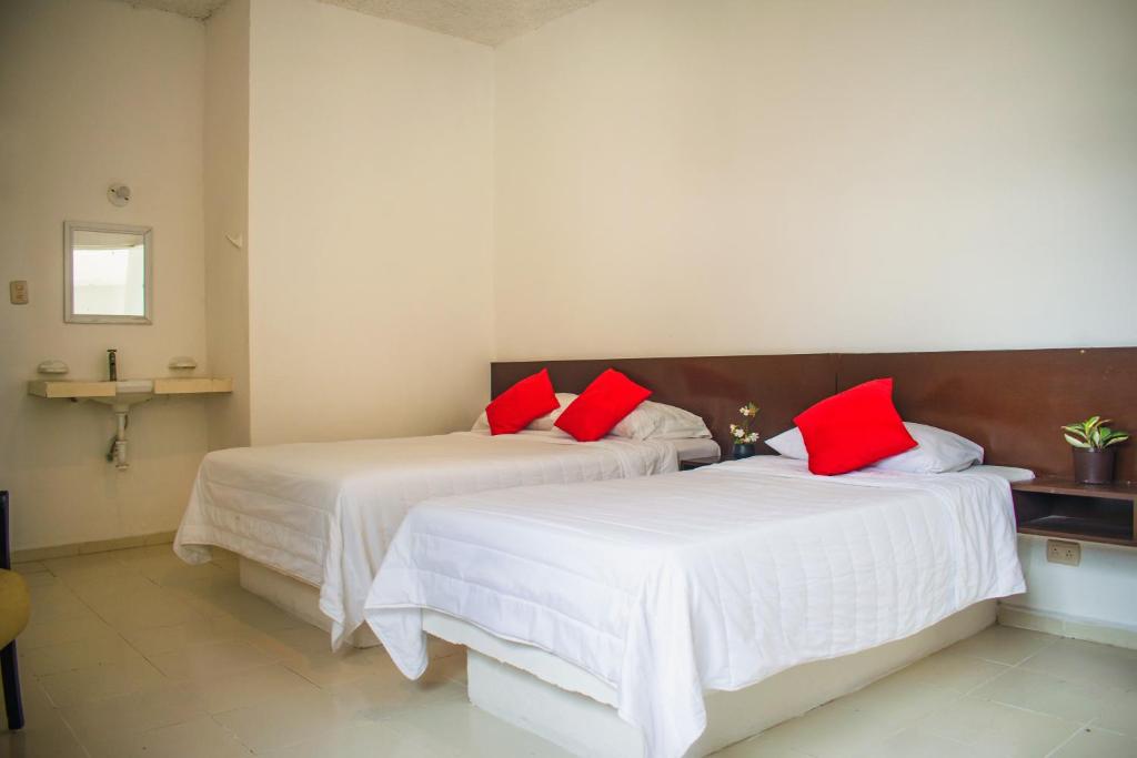 Postel nebo postele na pokoji v ubytování Hotel Cupules
