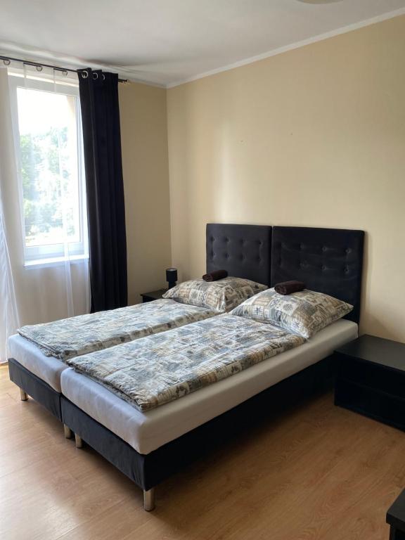 Postel nebo postele na pokoji v ubytování Zajazd Kadar