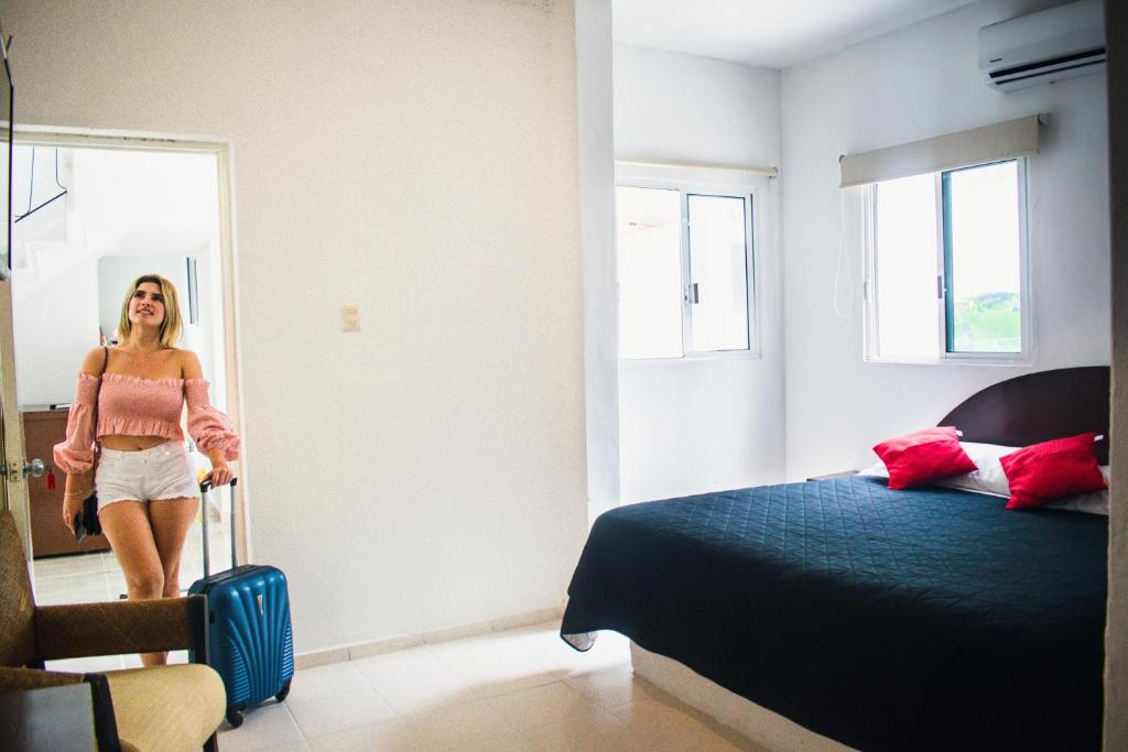 Postel nebo postele na pokoji v ubytování Hotel Cupules