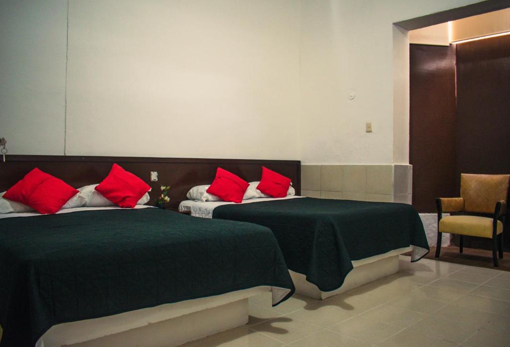 Postel nebo postele na pokoji v ubytování Hotel Cupules