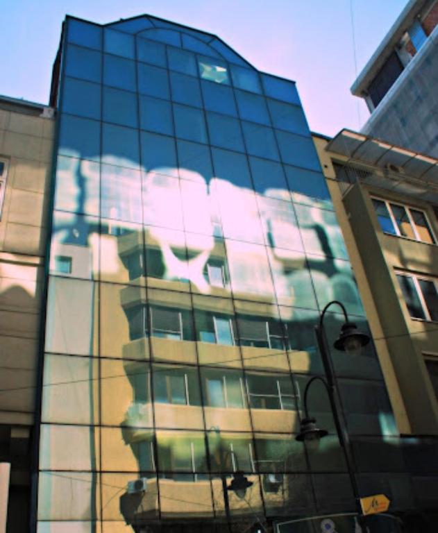 a building with a painting on the side of it at ANGELS View in Skopje