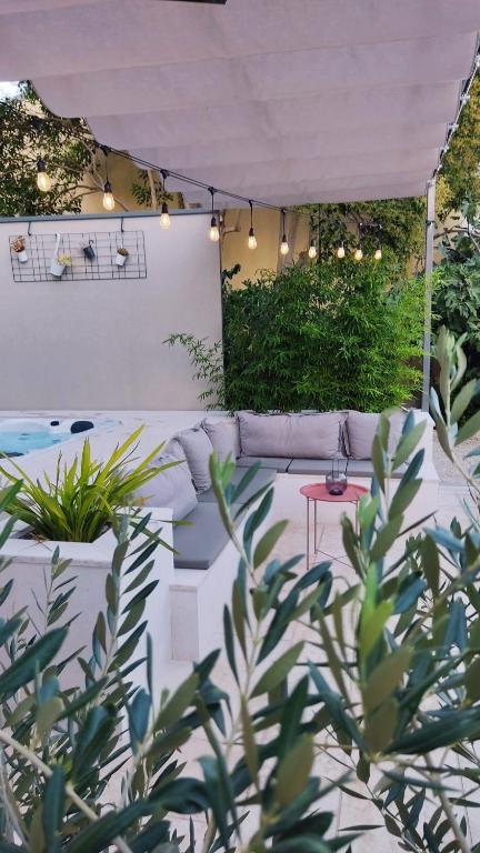 an outdoor patio with a table and a tent at Casa Viko in Premantura