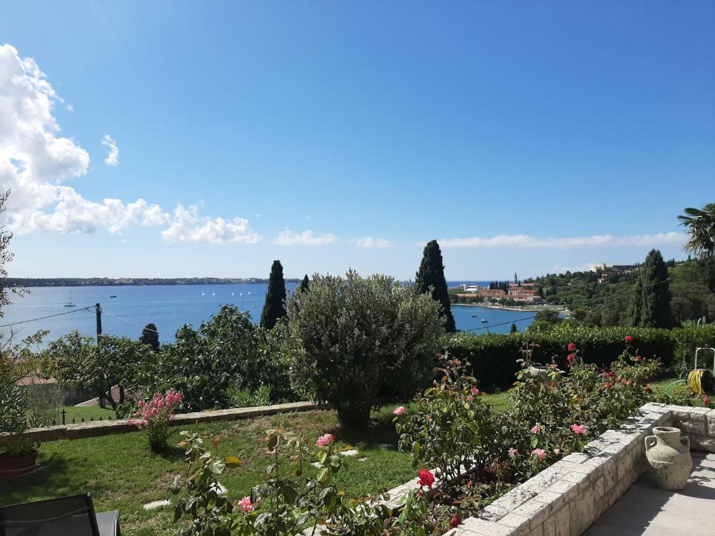 a garden with a view of the water at Apartment Solare in Portorož