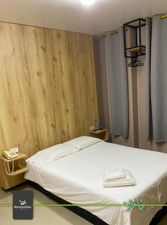 Postel nebo postele na pokoji v ubytování Hotel Wampushkar