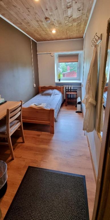 Postel nebo postele na pokoji v ubytování Cinema Hostel Järvakandi