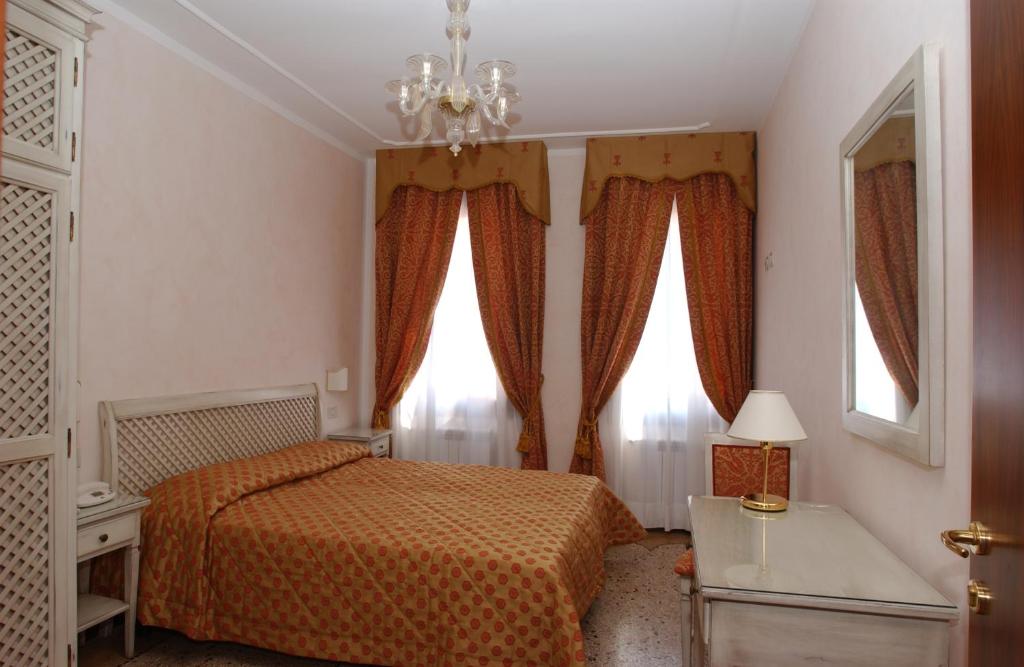 Posteľ alebo postele v izbe v ubytovaní Casa Mimma