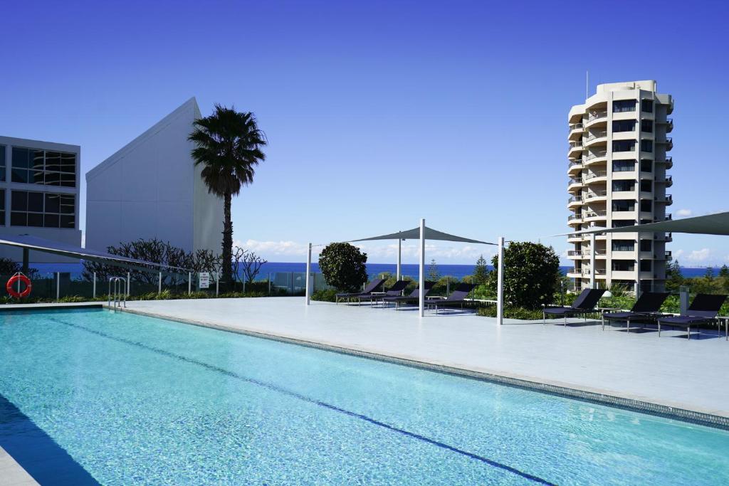 a swimming pool on the roof of a building at Air On Broadbeach-Stunning Ocean Views in Gold Coast