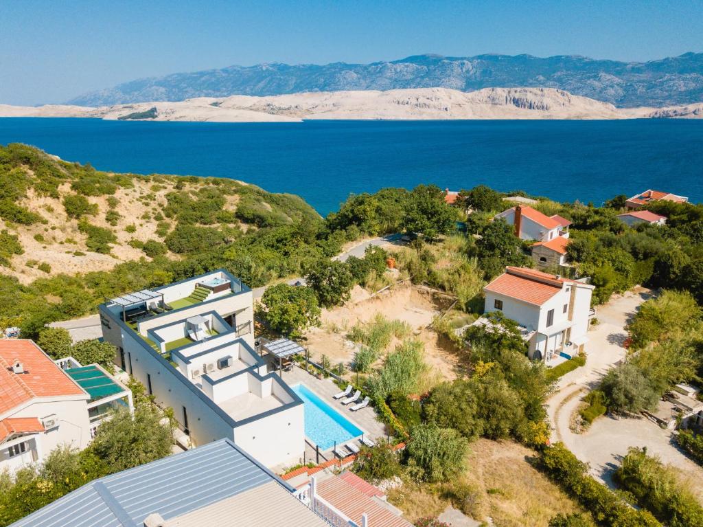an aerial view of a house with a swimming pool at Luxury villa with a swimming pool Bosana, Pag - 19824 in Pag