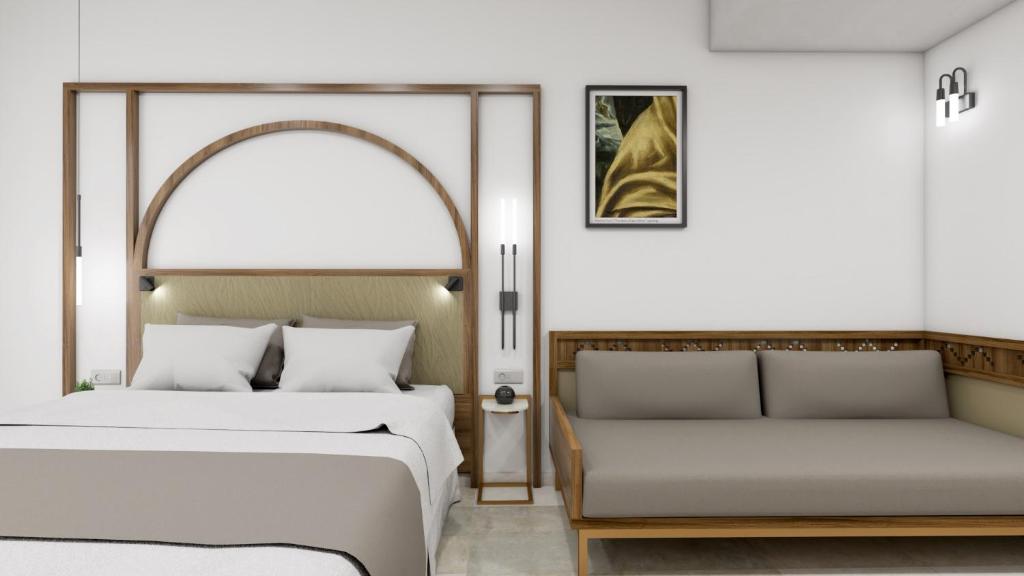 Postel nebo postele na pokoji v ubytování El Greco Hotel