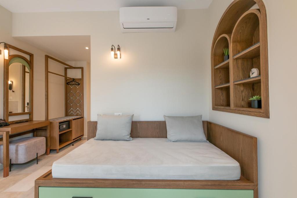 Postel nebo postele na pokoji v ubytování El Greco Hotel