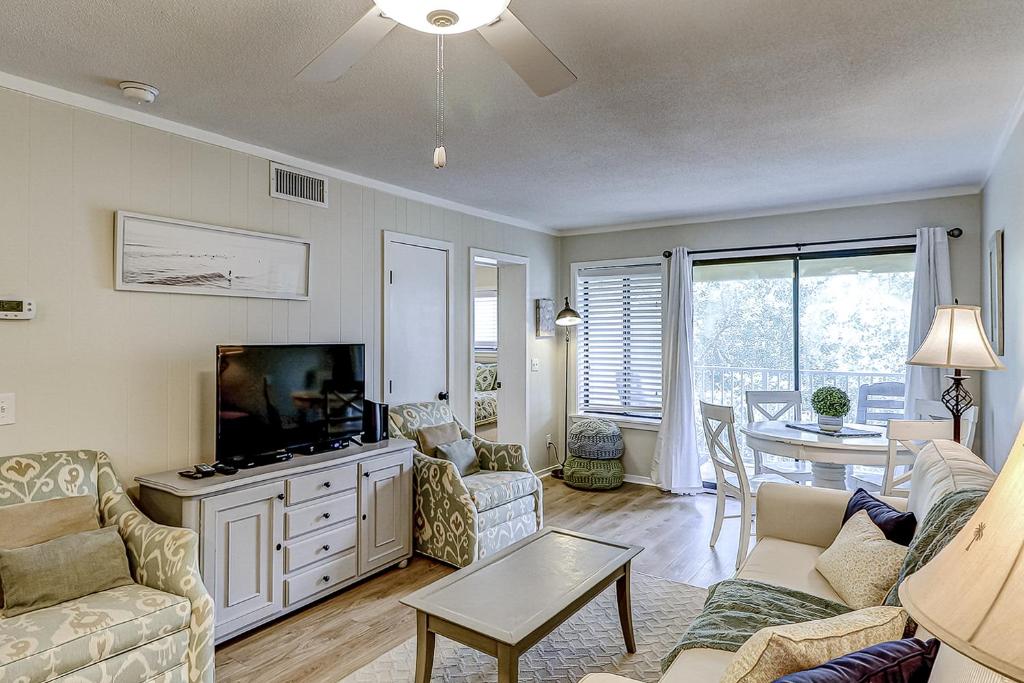 a living room with a couch and a flat screen tv at Hilton Head Resort 2314 in Hilton Head Island