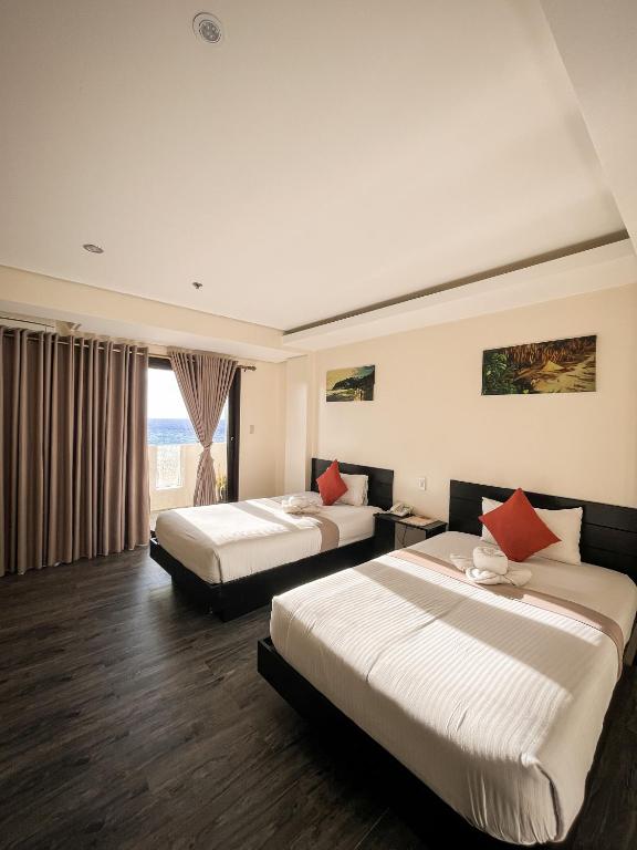 Postel nebo postele na pokoji v ubytování Navarro Hotel