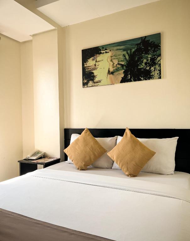 Postel nebo postele na pokoji v ubytování Navarro Hotel