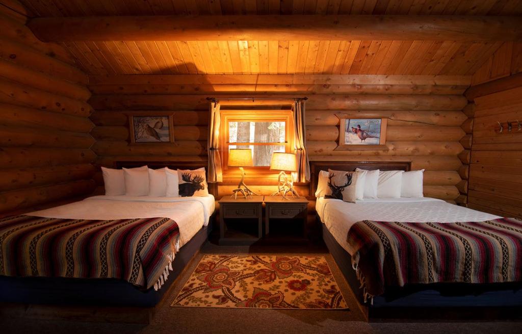 Voodi või voodid majutusasutuse Lochsa Lodge toas