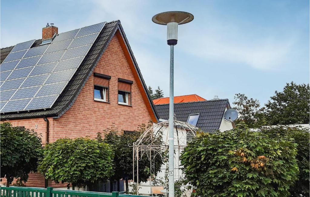 a house with solar panels on the roof at 3 Bedroom Beautiful Home In Neubrandenburg in Neubrandenburg