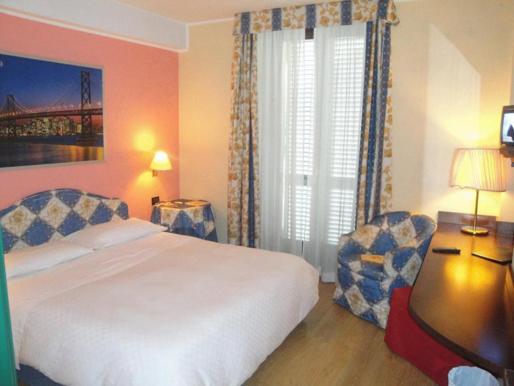 Postel nebo postele na pokoji v ubytování Hotel Due Mondi