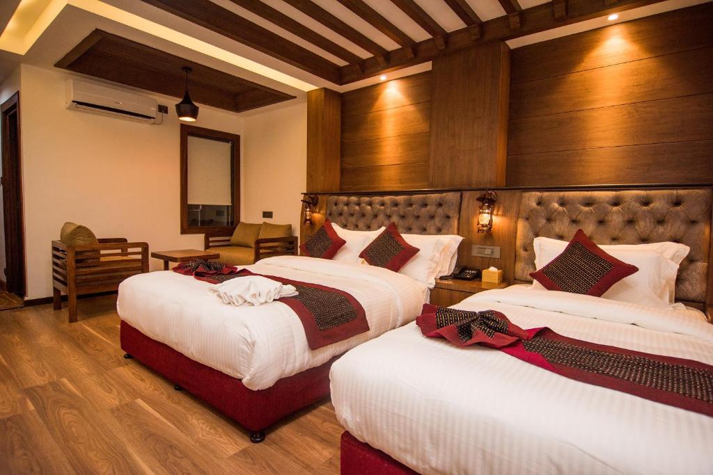 a hotel room with two beds in a room at Everest Boutique Hotel in Kathmandu