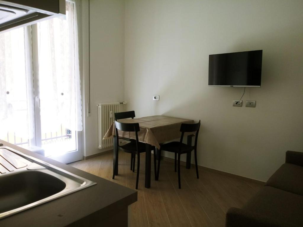 Televízia a/alebo spoločenská miestnosť v ubytovaní Casa Artemisia