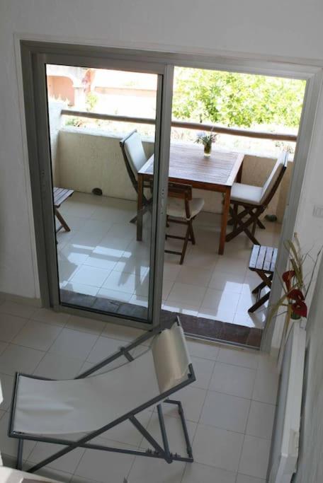 a view of a room with a table and chairs at Coquet appartement dans mazet Ste Maxime (Riviera) classé 3 in Sainte-Maxime