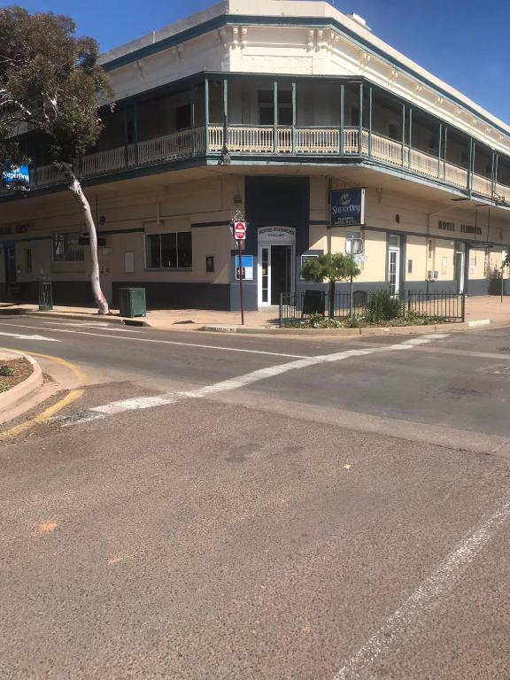 an empty street in front of a building at The Flinders Hotel Motel Port Augusta in Port Augusta