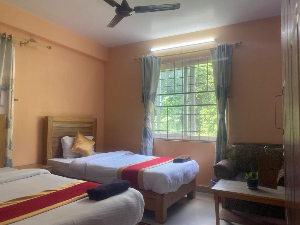 Ліжко або ліжка в номері Thanapati Guesthouse