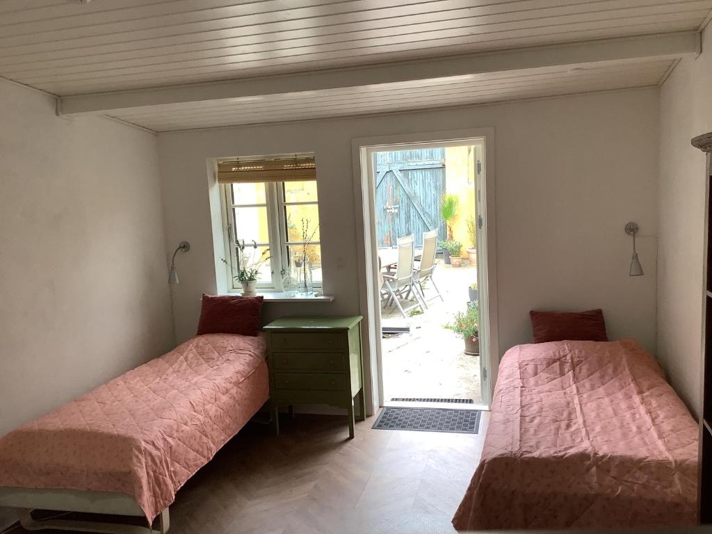 Postel nebo postele na pokoji v ubytování Cafebrumman