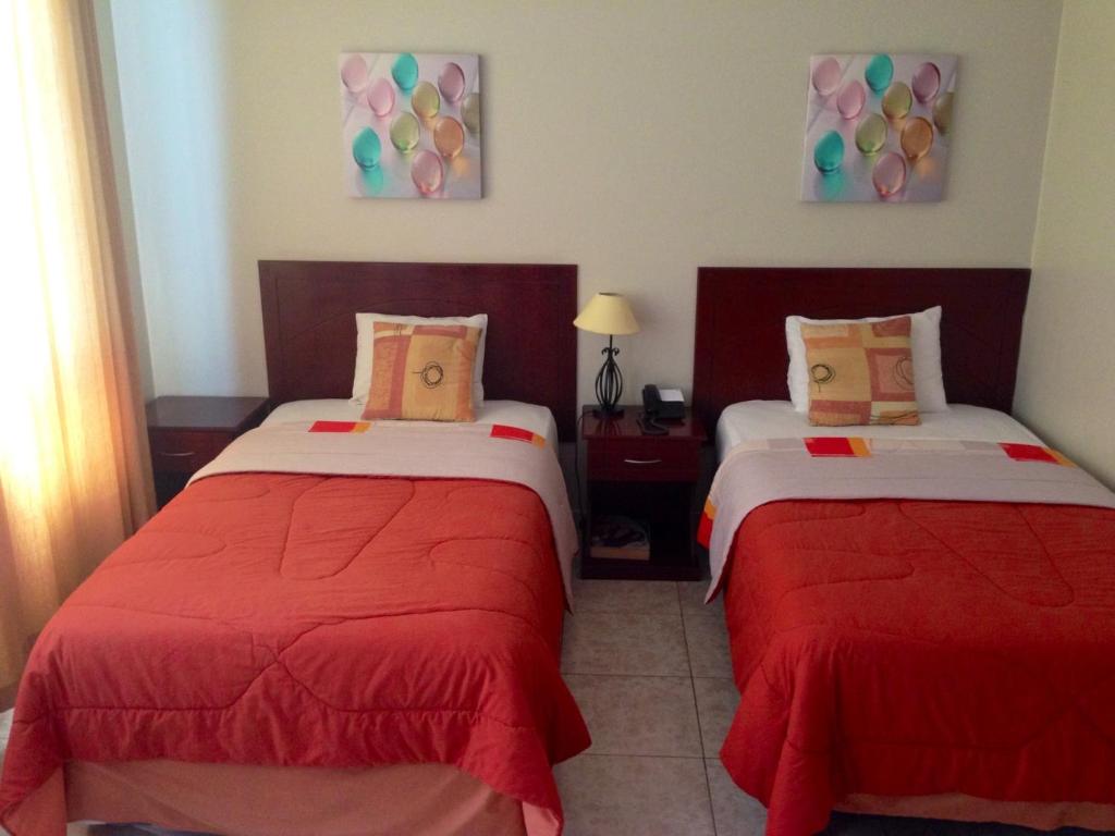 Postel nebo postele na pokoji v ubytování Hotel Air Suites