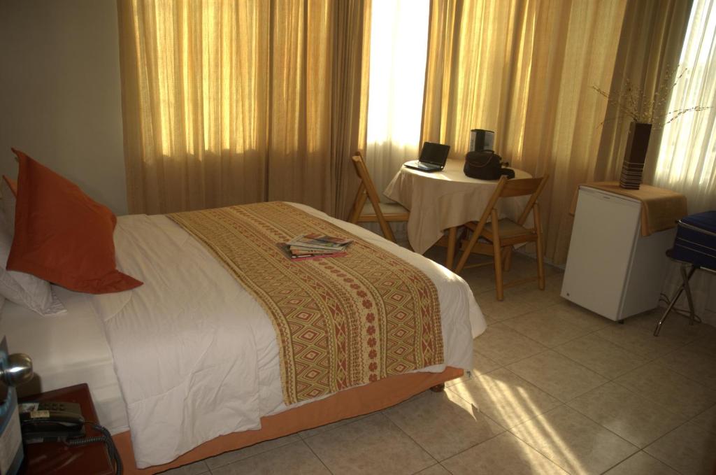 Postel nebo postele na pokoji v ubytování Hotel Air Suites