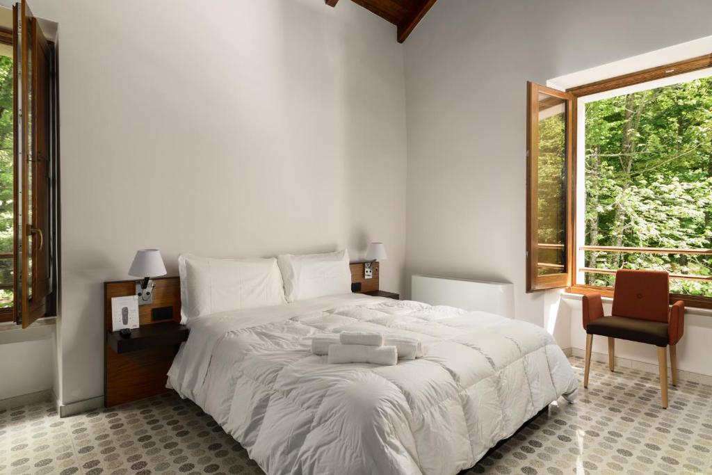 Letto o letti in una camera di Elda Hotel