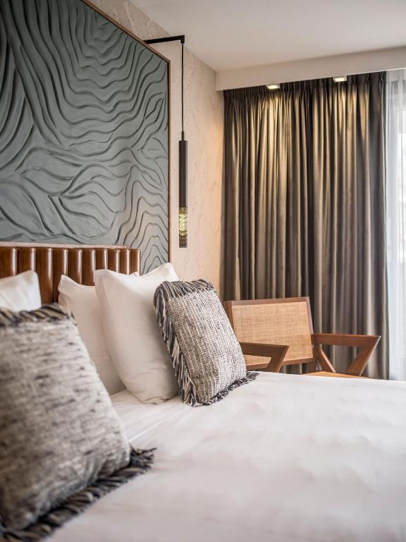 Un ou plusieurs lits dans un hébergement de l'établissement Alexander Hotel