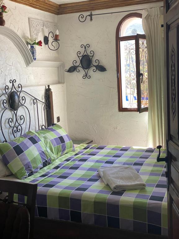 Postel nebo postele na pokoji v ubytování Casa Elias