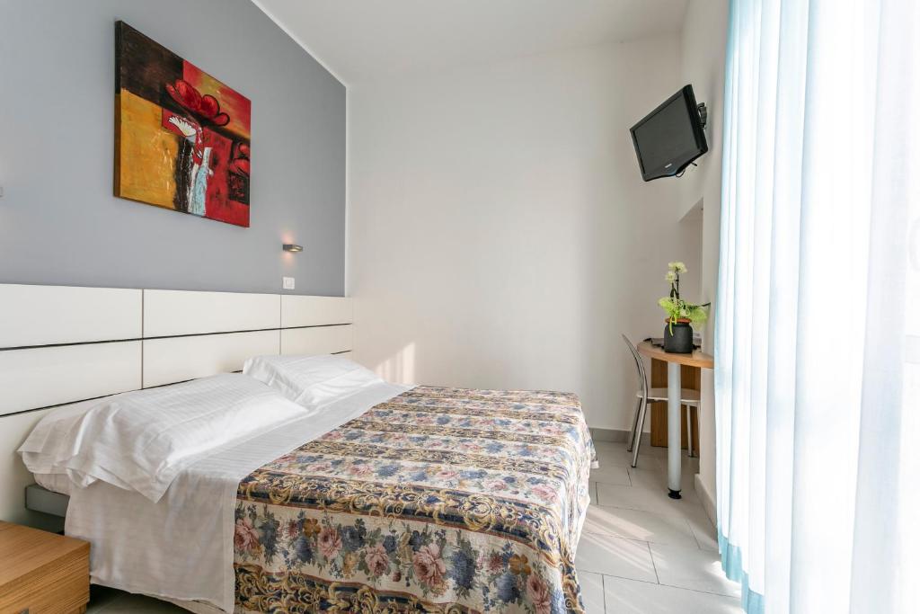 Postel nebo postele na pokoji v ubytování Hotel Baya - in centro, sul mare