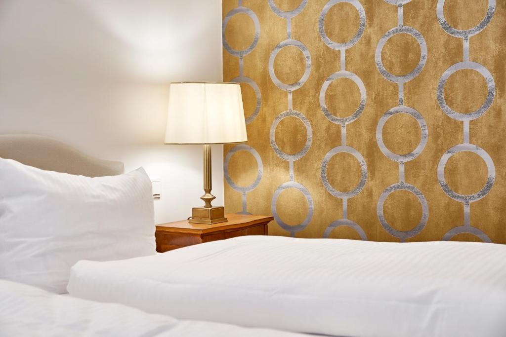Postel nebo postele na pokoji v ubytování Hotel Kraft