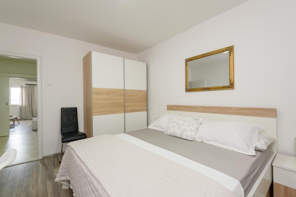 Postel nebo postele na pokoji v ubytování Apartment Tina