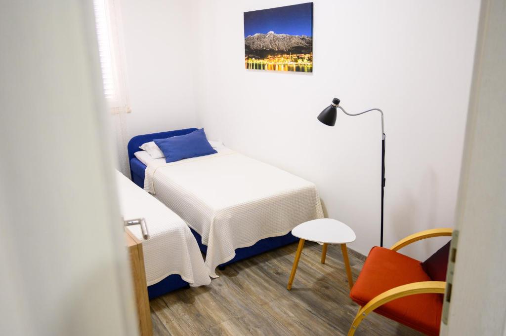 Postel nebo postele na pokoji v ubytování Apartment Tina
