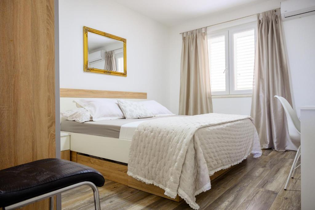 Postel nebo postele na pokoji v ubytování Apartment Tina