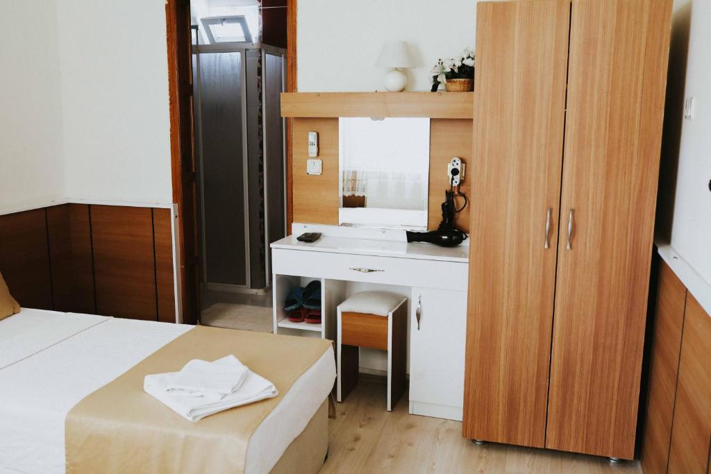 Postel nebo postele na pokoji v ubytování Kervansaray Hotel