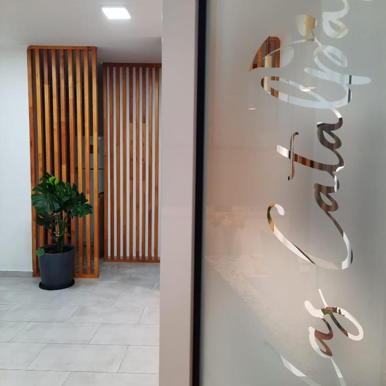 a glass display case with shoes in a hallway at Las Catalpas in Macachín