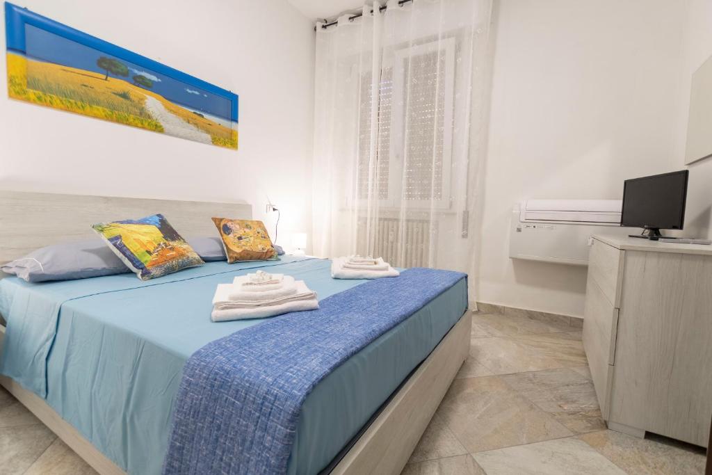 Postel nebo postele na pokoji v ubytování LE MURA Station Modern House - Parcheggio & Wi-Fi Gratis