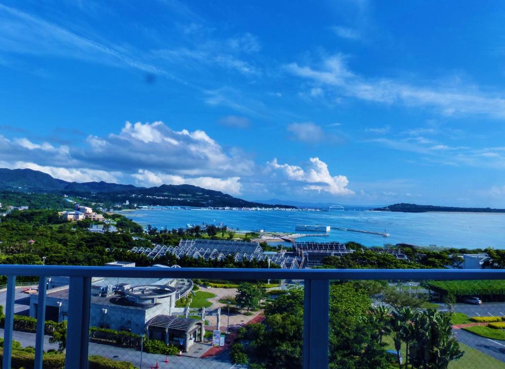 a view of the ocean from the balcony of a resort at Ocean Front YAMAKAWA in Motobu