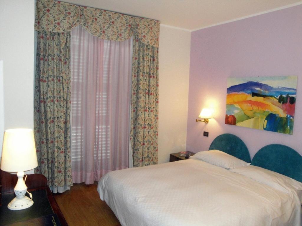 Postel nebo postele na pokoji v ubytování Hotel Due Mondi