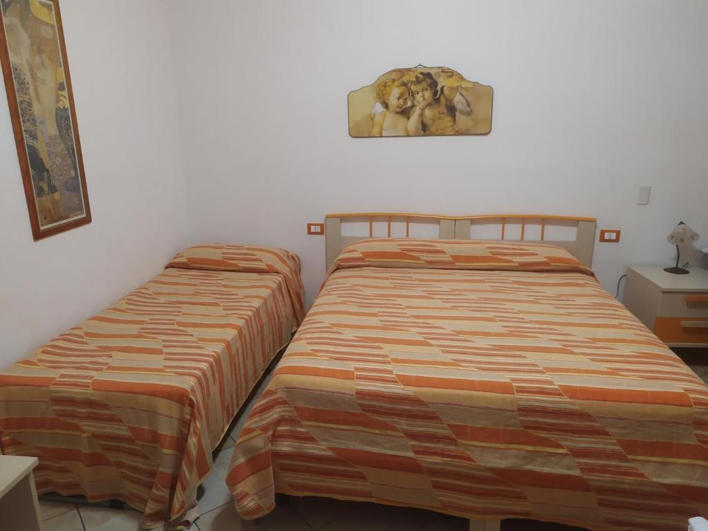 Postel nebo postele na pokoji v ubytování Oasi del Sud