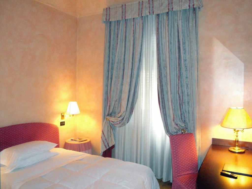 Postel nebo postele na pokoji v ubytování Hotel Due Mondi