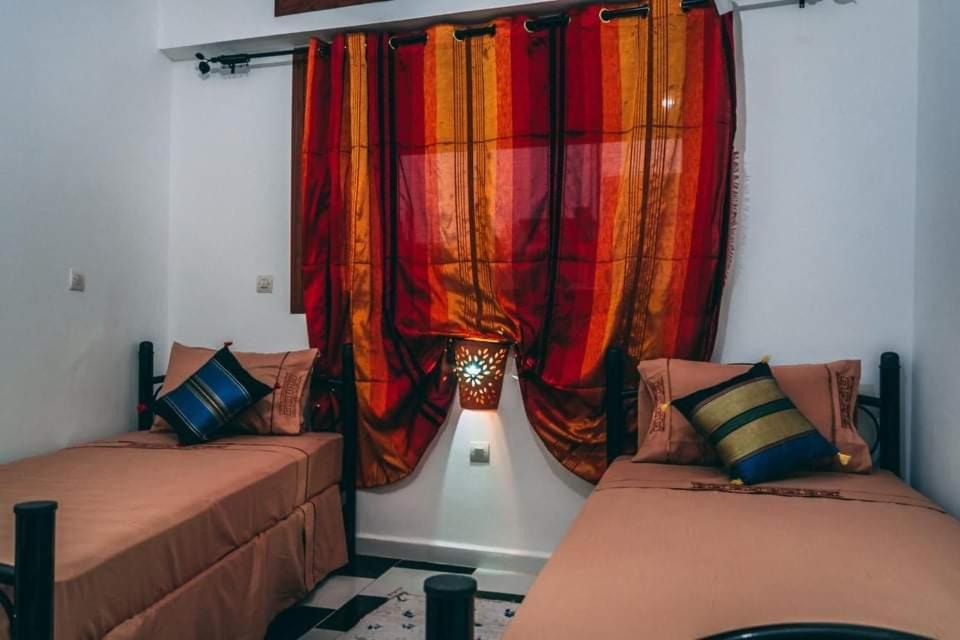 Letto o letti in una camera di Dar Rita