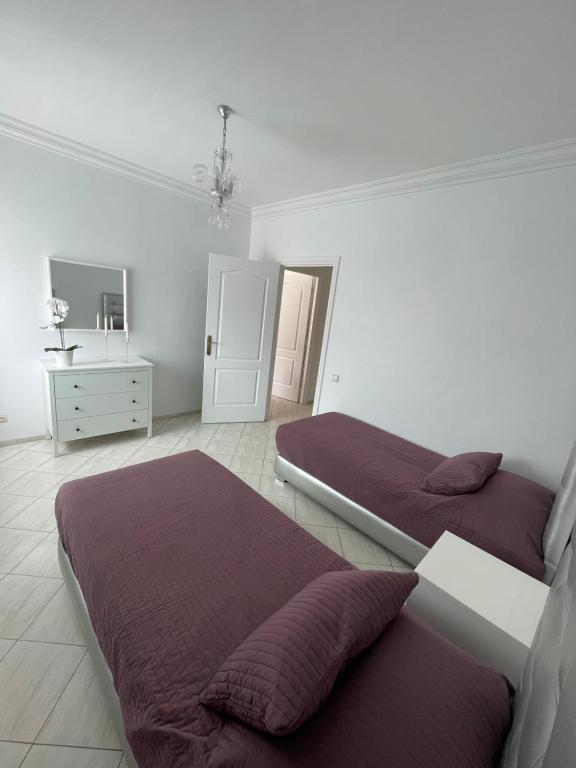 Ένα ή περισσότερα κρεβάτια σε δωμάτιο στο Appartement standing spacieux Casablanca