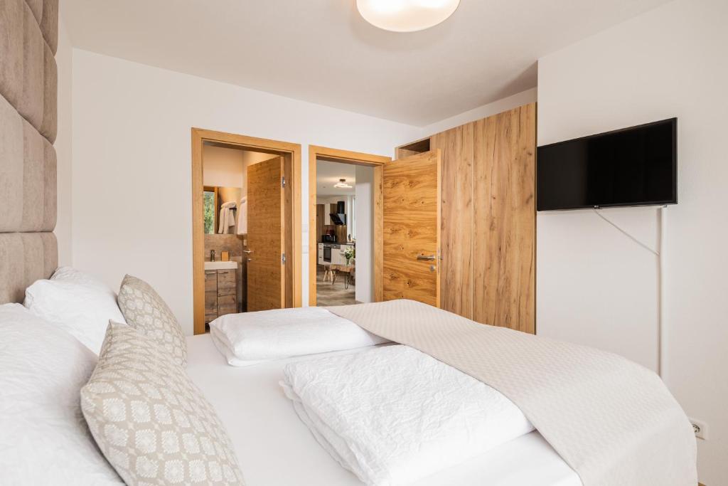Postel nebo postele na pokoji v ubytování Granit Appartements