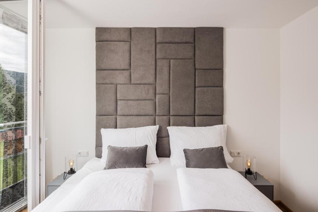 Postel nebo postele na pokoji v ubytování Granit Appartements
