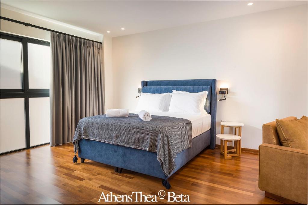 a hotel room with a bed and a couch at AthensThea Beta Luxury Penthouse Apt in Omonia in Athens