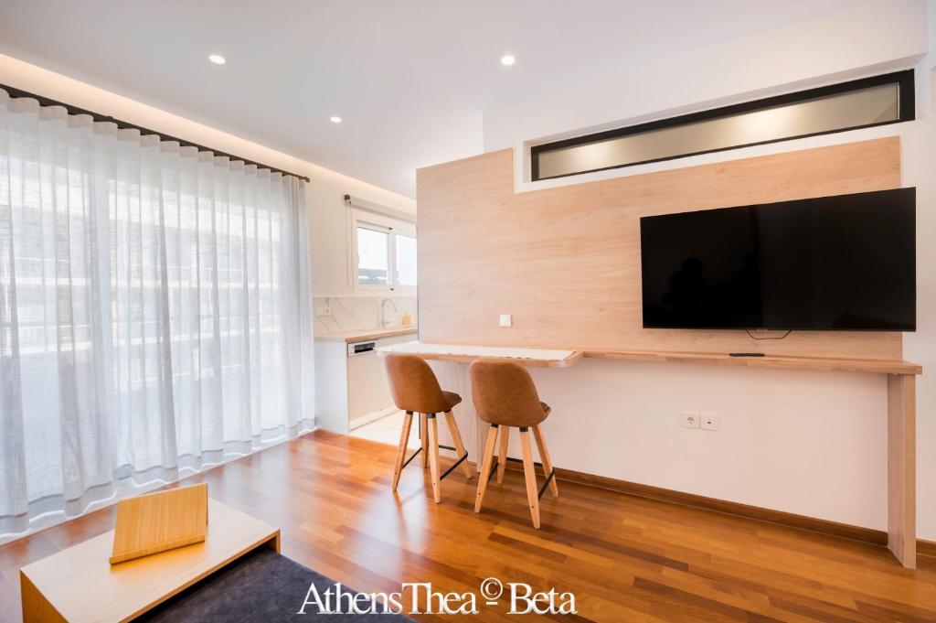A television and/or entertainment centre at AthensThea Beta Luxury Penthouse Apt in Omonia